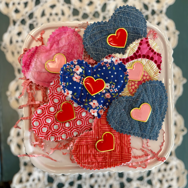 group fabric hearts with pink and red enamel pins